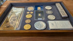 A tray containing various coins
